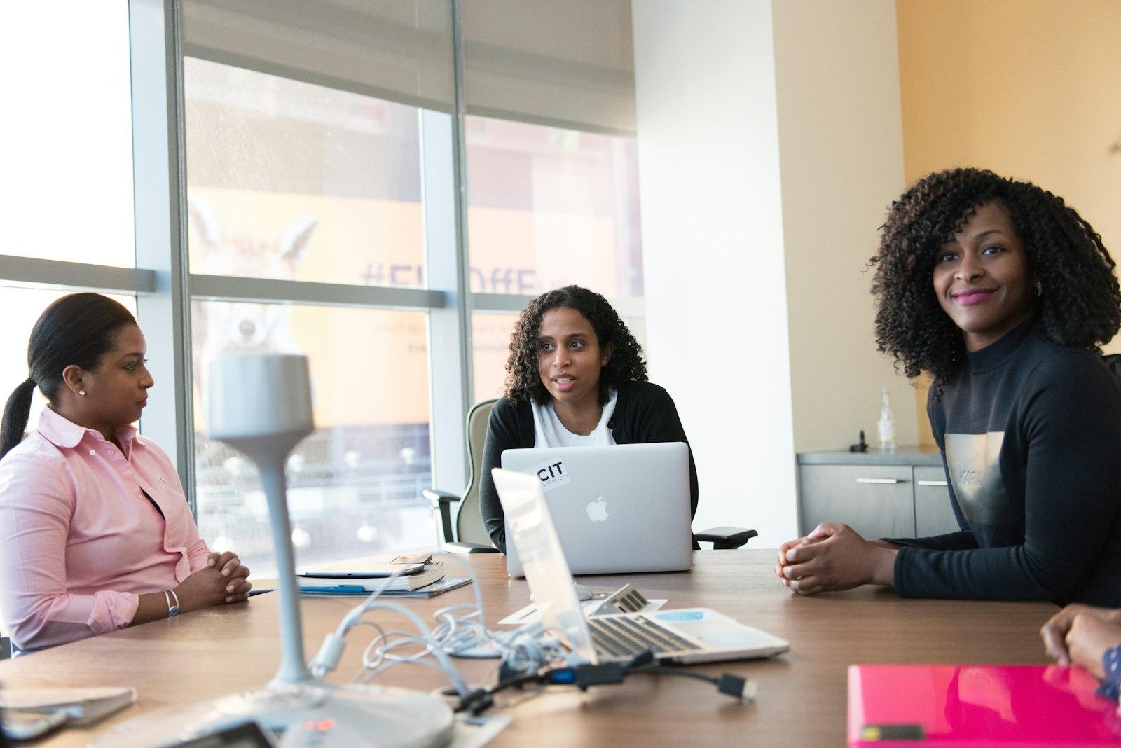 Treasury team reviewing figures around a boardroom table